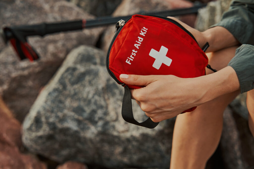 First aid kit in hands of a tourist